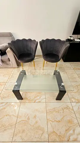 Elegant Glass Coffee Table with Chic Grey Chairs