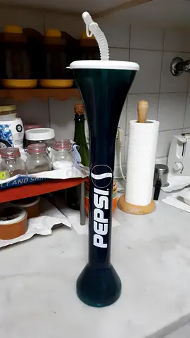 Tall drinking cup with capped long straw Pepsi brand