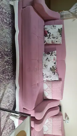 Elegant Pink Velvet Sofa with Floral Cushions