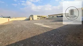 A prime industrial yard for rent in Umm Al Quwain – spacious area with a canopy, offices, and read