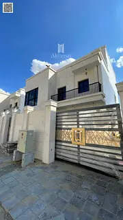 Luxury Corner Villa for Sale in Al Zahya Ajman featuring elegant stone façade, spacious modern desi