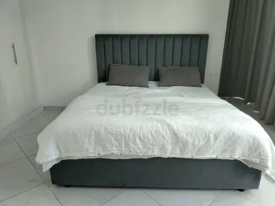 Comfortable Upholstered Bed with Pillows