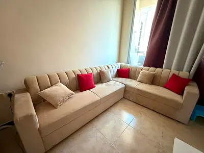Comfortable L-Shaped Sofa with Cushions