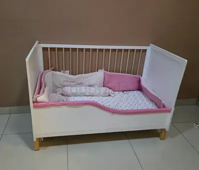 USED Functional Baby  toddler Crib with mattress for sale - adjustable closure.