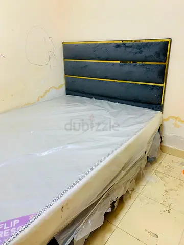 Sleek Black and Gold Bed Frame with Mattress 2 single bed