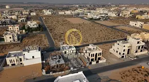 Commercial land for sale on Mleiha Street, directly on a corner with three streets, with a very exce