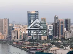 Two bedrooms and a living room in Al Qasba area, Najmat Al Qanat Tower, with a view. Rent is 6500 di