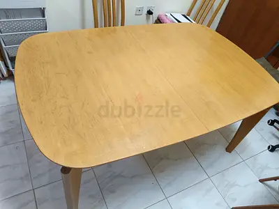 Sturdy Wooden Dining Table with Extendable Leaf