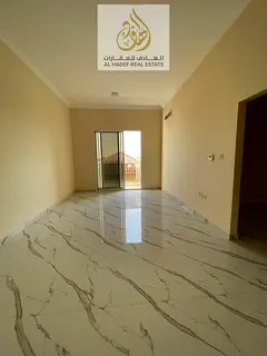 Annual rent in Ajman, Al Muwaihat 3 area, near Al Shuwaifat School and Ajman Academy. The building i