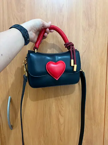 Charles  Keith Heart-Motif Coiled Top Handle Bag in black