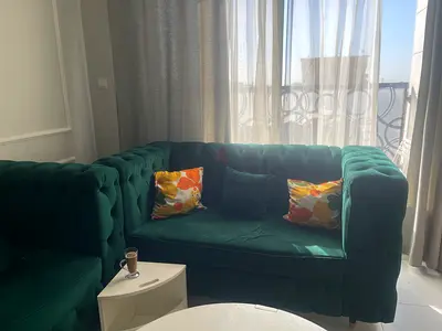 Elegant Green Velvet Sofa Set with Colorful Cushions