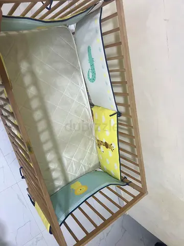 Charming Crib with Adorable Bedding for Your Baby