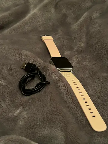 Pink Smart Watch with Charging Cable