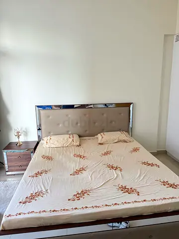 Elegant queen size Bed with Soft Upholstered Headboard side table and dressing table. A complete set