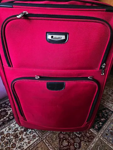 Delsey Red Travel Luggage - Perfect for Your Next Adventure. Used Only Once. AED 130. Free Delivery.