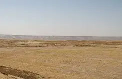 Two adjacent plots of land for sale in Al-Hawshi, one corner and one regular.