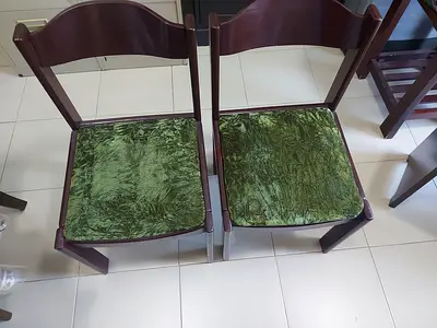 2 wooden chairs with cushion seating