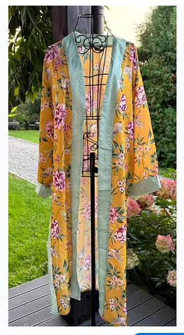 A yellow floral kimono from NEW LOOK. It was sold exclusively at Bloomingdales. The kimono is brigh