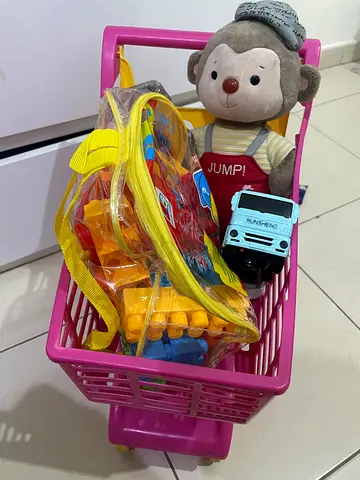 Colorful Toy Shopping Cart with Stuffed Monkey and Building Blocks
