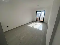 Brand new building, first occupancy. For annual rent in Ajman. Two-bedroom apartment with a living r