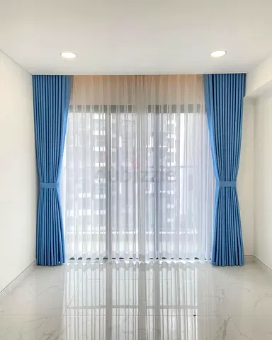 Elegant Blue and White Sheer Curtains for a Bright Space