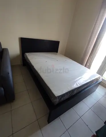 IKEA malam king‑size bed (180 × 200 cm) with an IKEA mattress