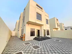 A villa for rent in Ajman, Al Bahia area, consisting of two floors and has a living room, a hall, a