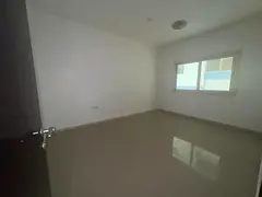 Master bedroom and living room on Al Taawun Street with 2 bathrooms and sandy or investment parking.