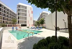 Studio for sale in Aljada, ground floor, priced at AED 390,000, currently rented with annual income