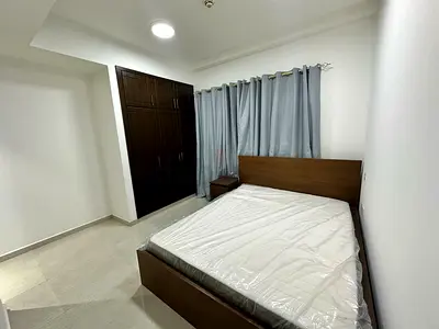 Furnished master bedroom with attached bathroom
