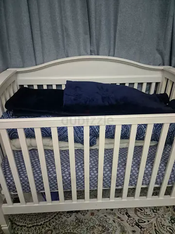 Gently Used Baby Crib with Cozy Bedding