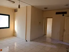 For annual rent in Sharjah, specifically in the Al Qasimia area: a one-bedroom apartment with a livi