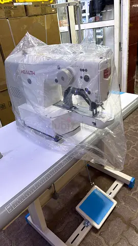 Kndora botton attach machine