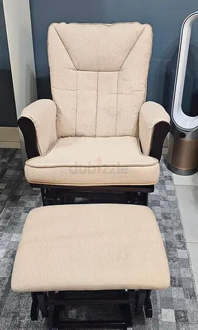 Swiving armchair with footrest still  new