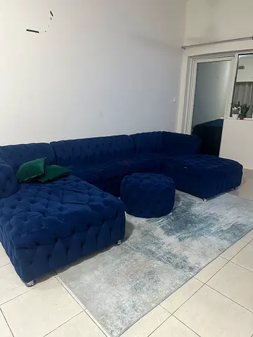 Elegant Blue Velvet Sofa Set with Matching Ottoman and Rug