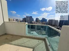 Two-bedroom apartment with living room for sale in Ajman One Towers, featuring a city view, built-in