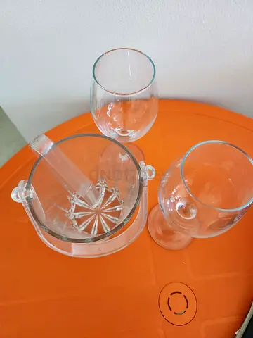 New Set of 4. 2 wine glasses 1 ice bucket with 1 fork clear glass handy and new
