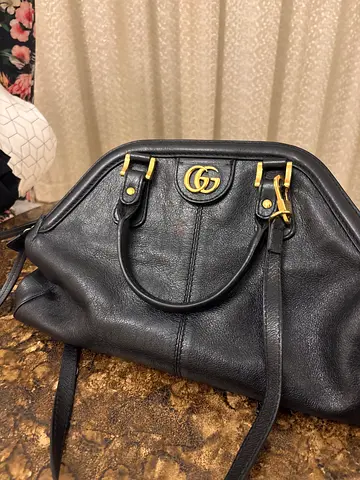 Chic Black Leather Handbag With Stylish Gold Accents