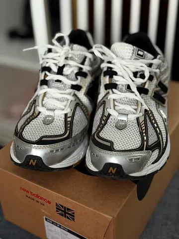 New Balance 1906R sneakers in the Metallic Silver/Gold colorway (model M1906RA