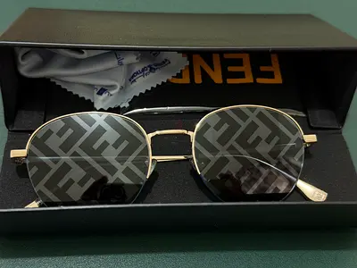 For Sale: Fendi Travel Sunglasses Stylish gold-tone metal frame paired with blue mirror-effect lense