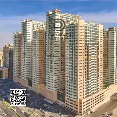 Own a 2-bedroom apartment with living room in Ajman One Towers, prime strategic location, high floor