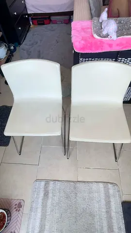 2 IKEA CHAIRs - chrome-plated underframe is topped with a soft, padded seat in durable leather.