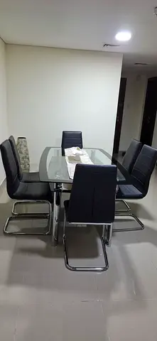 Modern Glass Dining Table with Stylish Chairs