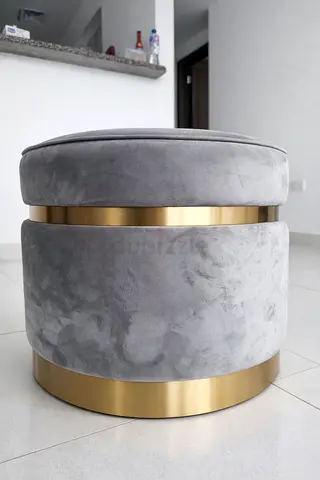 Stylish Gray Velvet Ottoman with Gold Accents