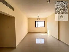 Al Nuaimiya 2, two-bedroom apartment with living room, located near Al Hikma School.
