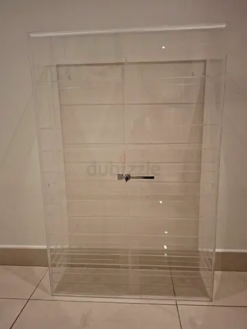 Acrylic display cabinet with locked doors