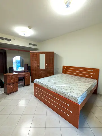 Stylish Brown Bedroom Furniture Set with Bed, Wardrobe, and Desk