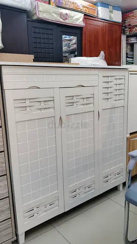Elegant White Cabinet with Decorative Panels