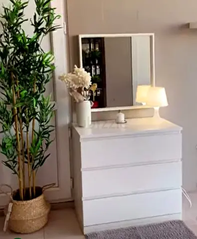 Elegant White Dresser with Mirror and Lamp