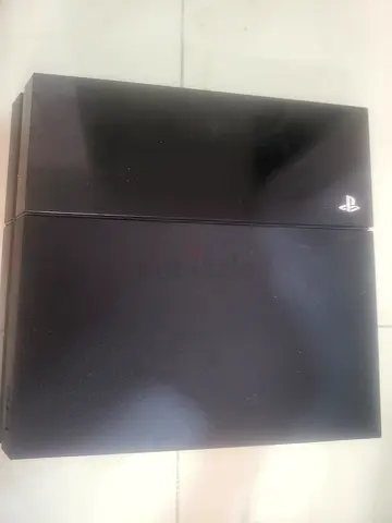 PlayStation 4 Console in Great Condition with controller and games delivery available